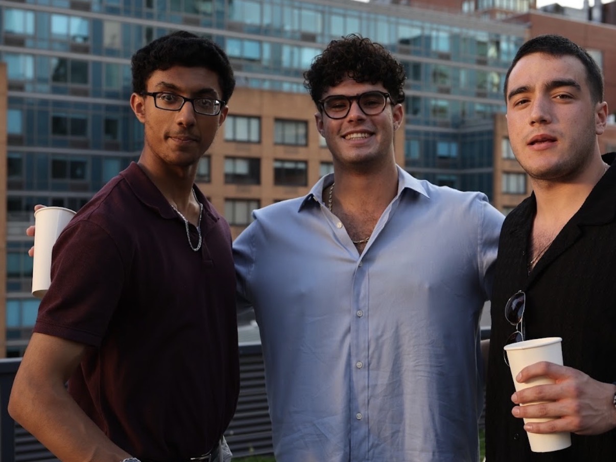 Sean with friends at a rooftop gathering